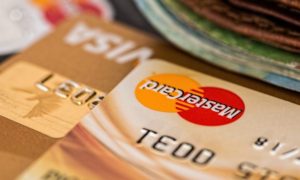 The easiest way to build your credit score is to get a credit card, actively use it, and pay your bills regularly.